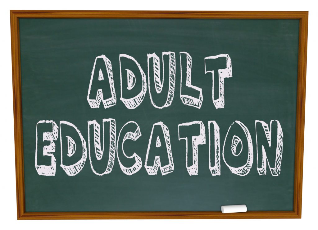 adult education text on chalkboard