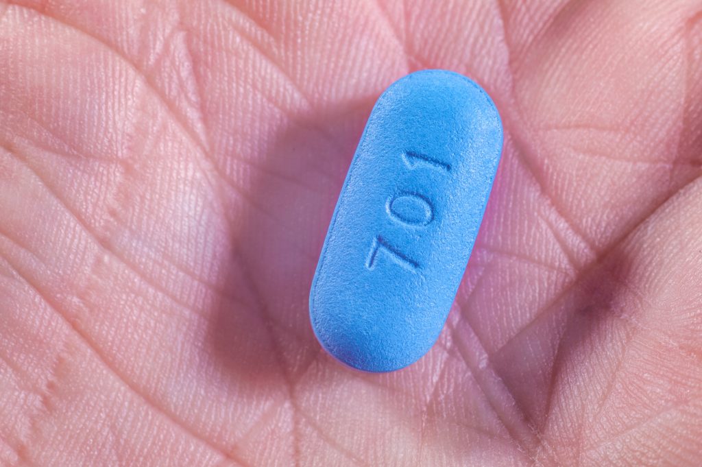 blue pill in hand
