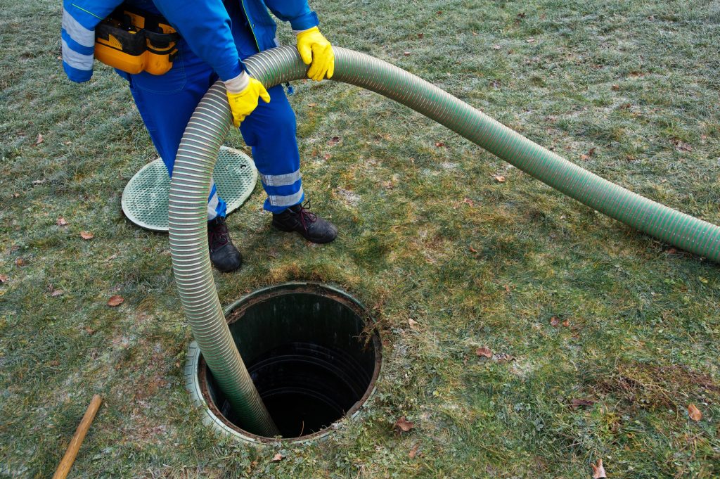 Professional Cleaning a Septic Tank Using a Pump